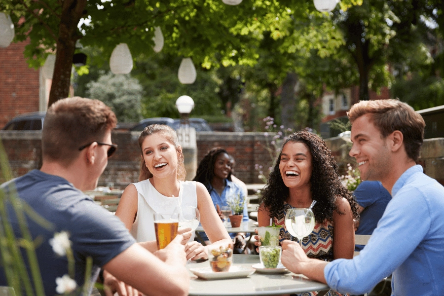 Group drinking outside pub