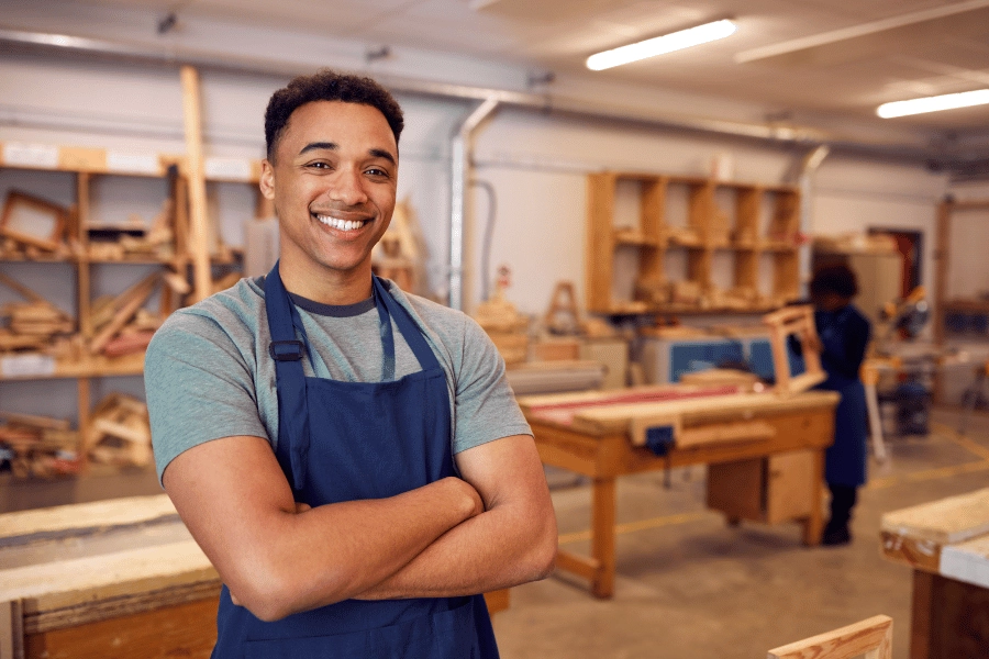 Young apprentice in a joinery workshop