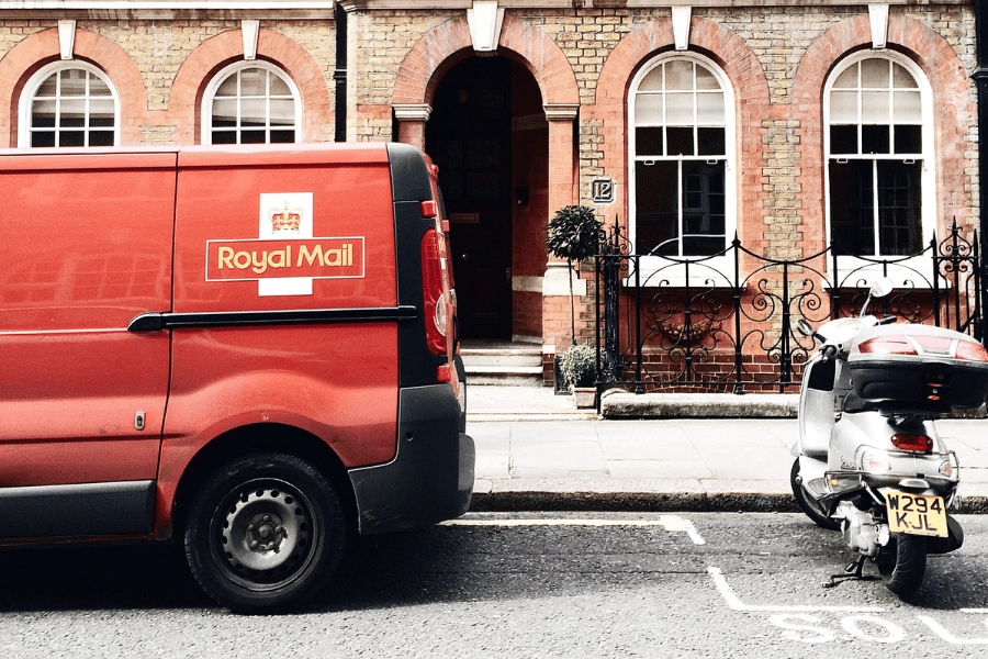 Royal Mail van parked outside a house