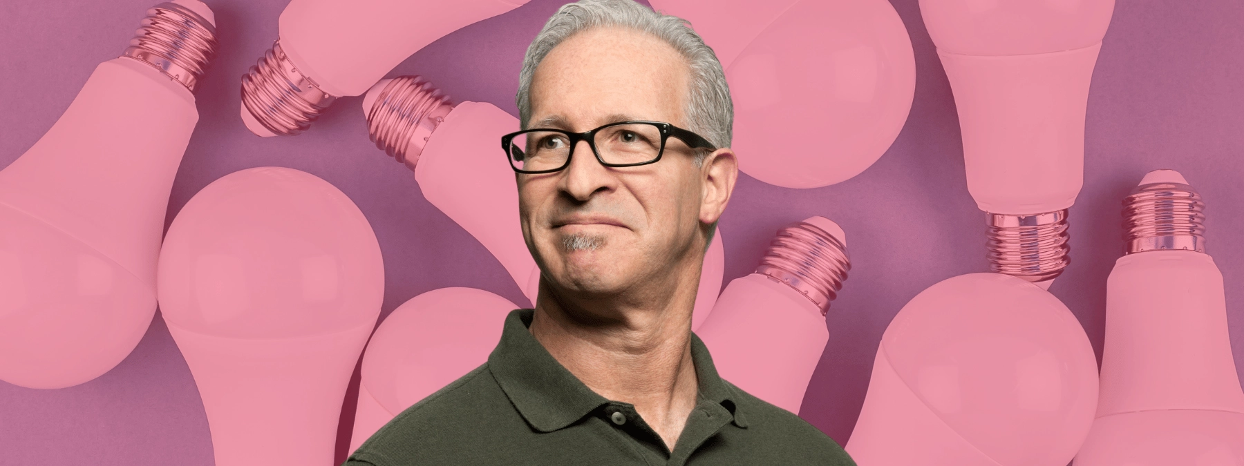 Man with glasses on a background of LED light bulbs